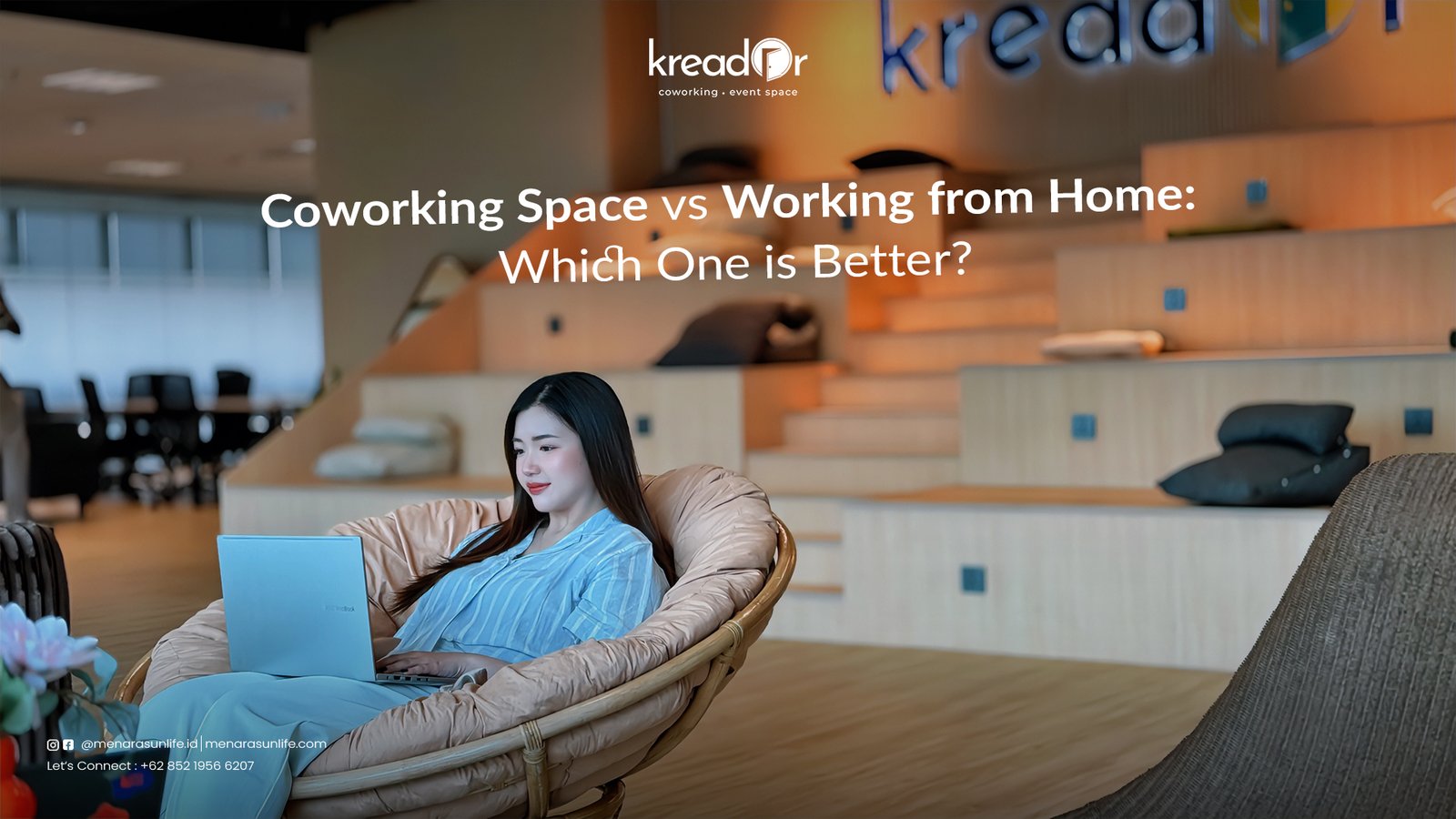 A woman working on a laptop in a modern coworking space