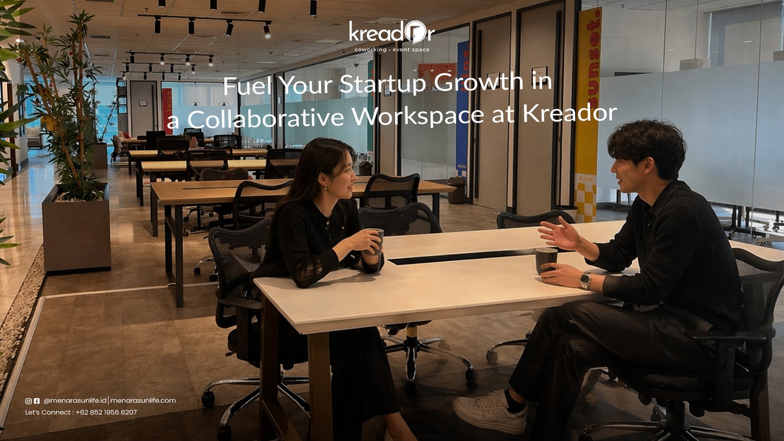 Two professionals having a discussion in a collaborative workspace at Kreador, reflecting a modern and productive environment for startups.